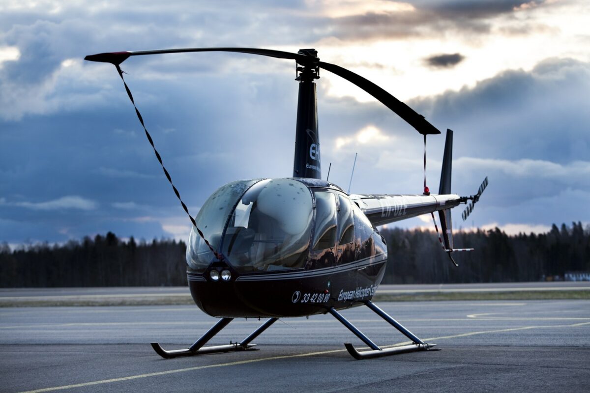 a helicopter sitting on top of an airport tarmac.
